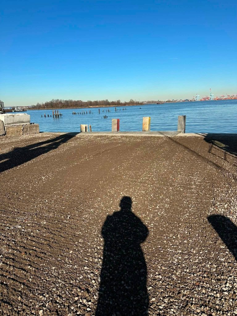 Finished concrete bulkhead and graded waterfront area ready for use in Staten Island