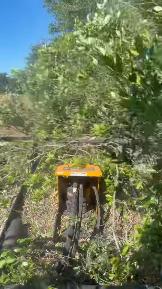 Close-up of the 78-inch Quick Attach Mega Mower X clearing thick brush at Valhalla Farms